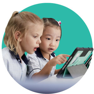 Two primary school students are studying something on the tablet