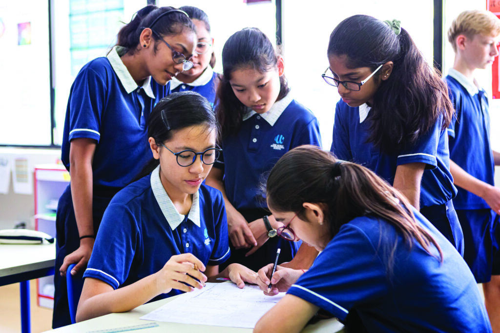 Middle school students are working together