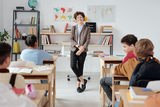 A teacher standing in a classroom