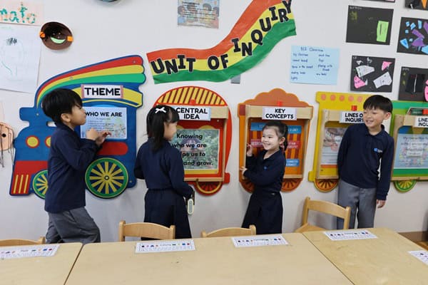 English Is the language instruction at OWIS Osaka, Early Childhood (EC) students play with the IB Unit of Inquiry Train in the classroom