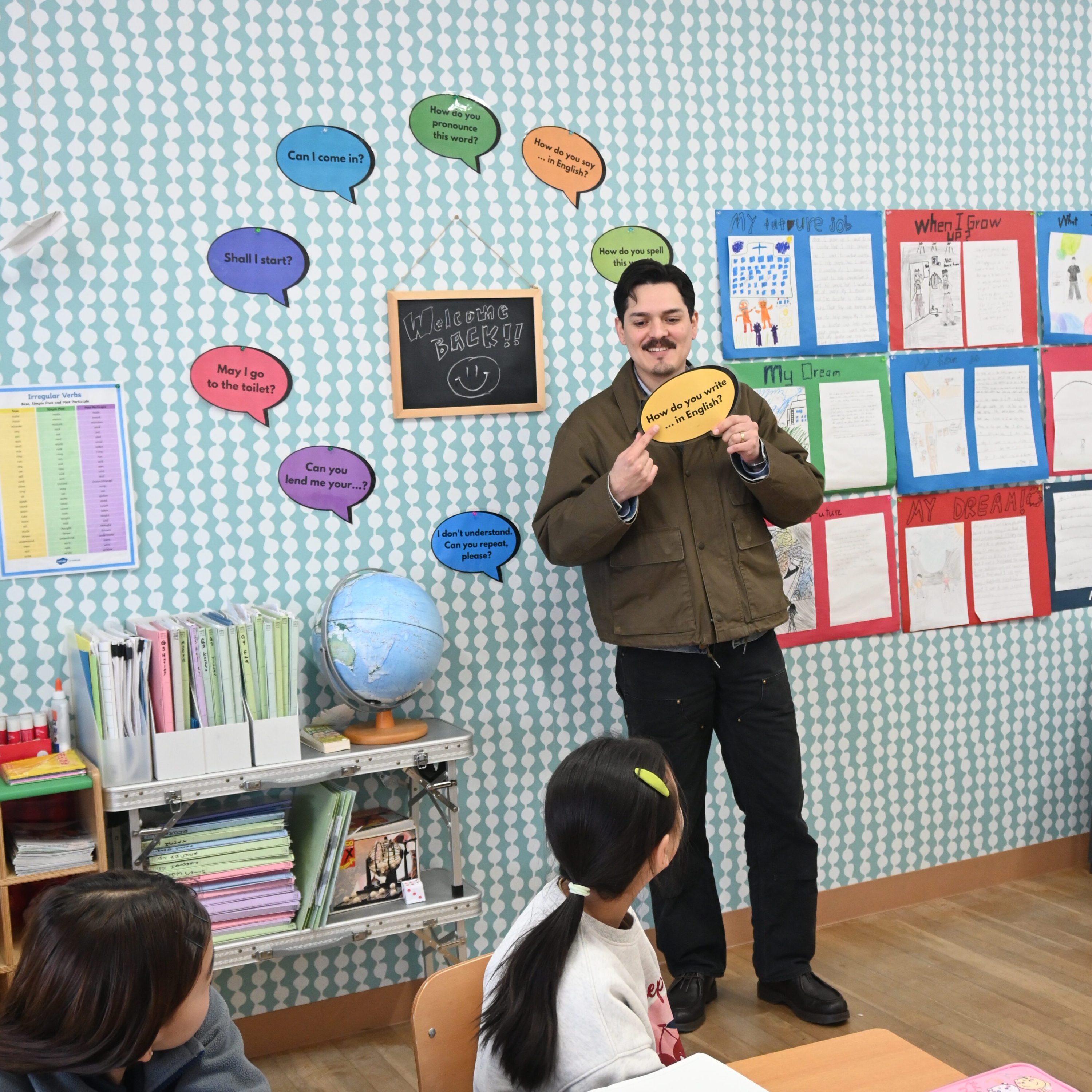 AEP teachers teaching Academic English preparation class holding speech bubble