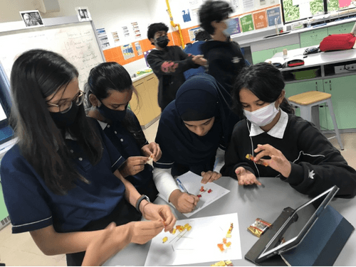 Students in a Grade 7 Science lesson at OWIS Nanyang Secondary School