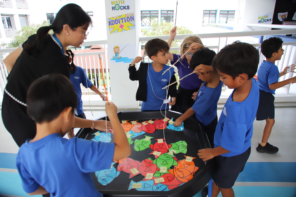 Students actively participating in math activities at OWIS Nanyang Maths Day 2023.