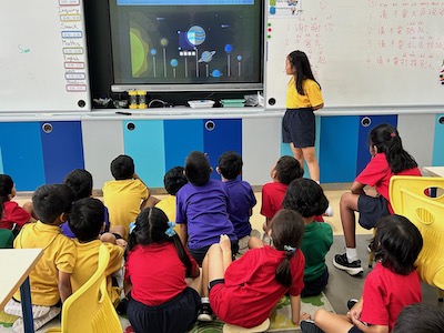 Image illustrating OWIS Nanyang Primary students deeply engaged in IBPYP, specifically centered around the theme of space exploration