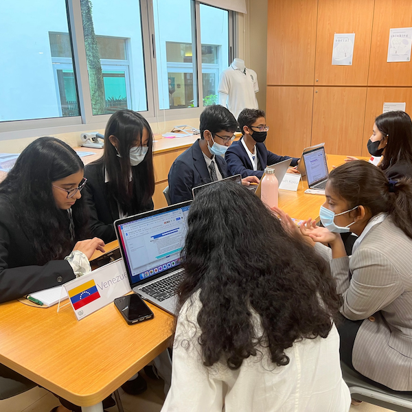 Students actively participating in the One World International School Nanyang Secondary Model United Nations