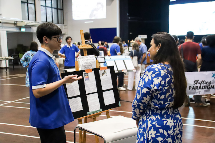 IBDP student at OWIS Nanyang presenting his project in ToK exhibition - Leading IB School in Singapore