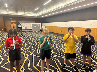 Primary students at OWIS Suntec learn to play the recorder as part of holistic development | School in city centre of Singapore